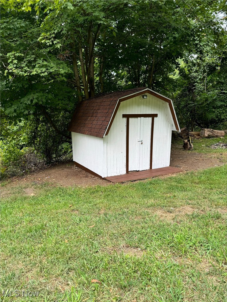 360 Bradys Ridge Road Wellsburg, WV 26070 - Photo 27 of 36 View of outbuilding with a yard