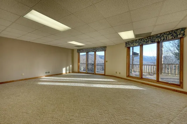 a view of a bedroom with large windows