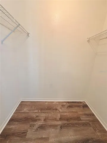 a view of building with car parked