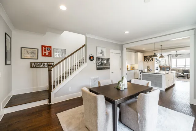 a kitchen with stainless steel appliances granite countertop sink stove and refrigerator