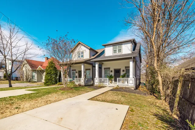 a view of balcony with a potted plant and wooden fence