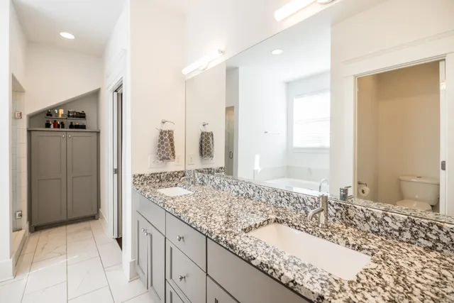 a bedroom with bed and a window