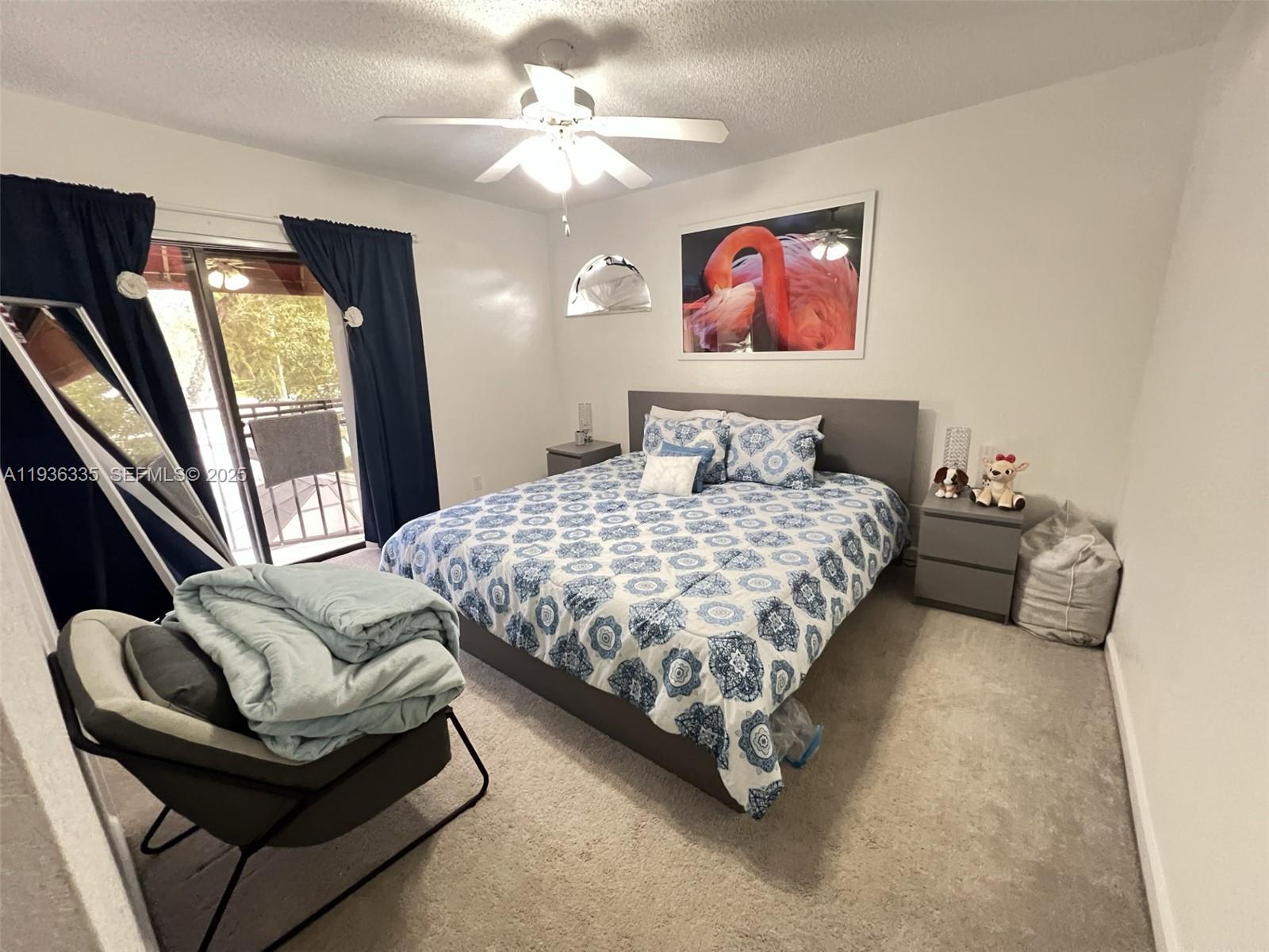 8116 Severn Drive, Unit C Boca Raton, FL 33433 - Photo 15 of 19 a bedroom with a bed couch and window