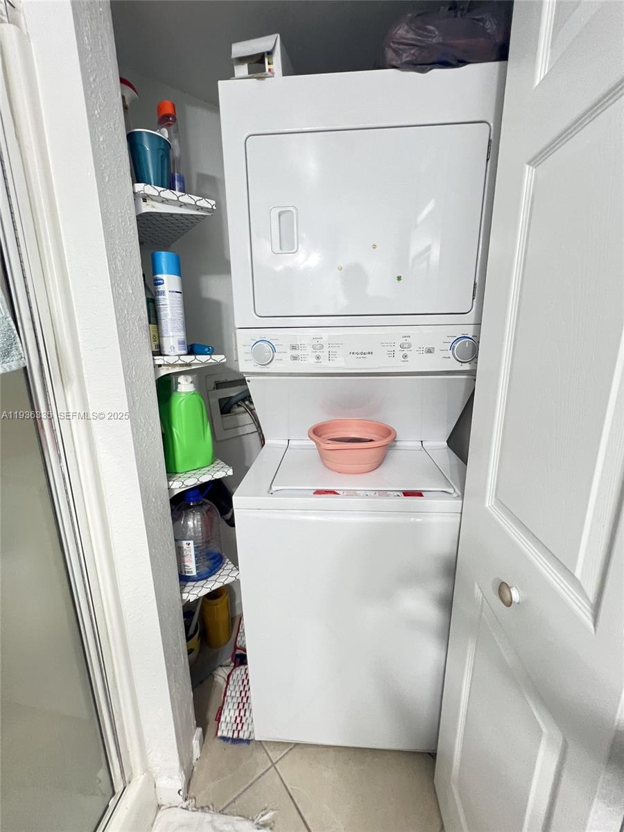 8116 Severn Drive, Unit C Boca Raton, FL 33433 - Photo 17 of 19 a utility room with dryer and washer