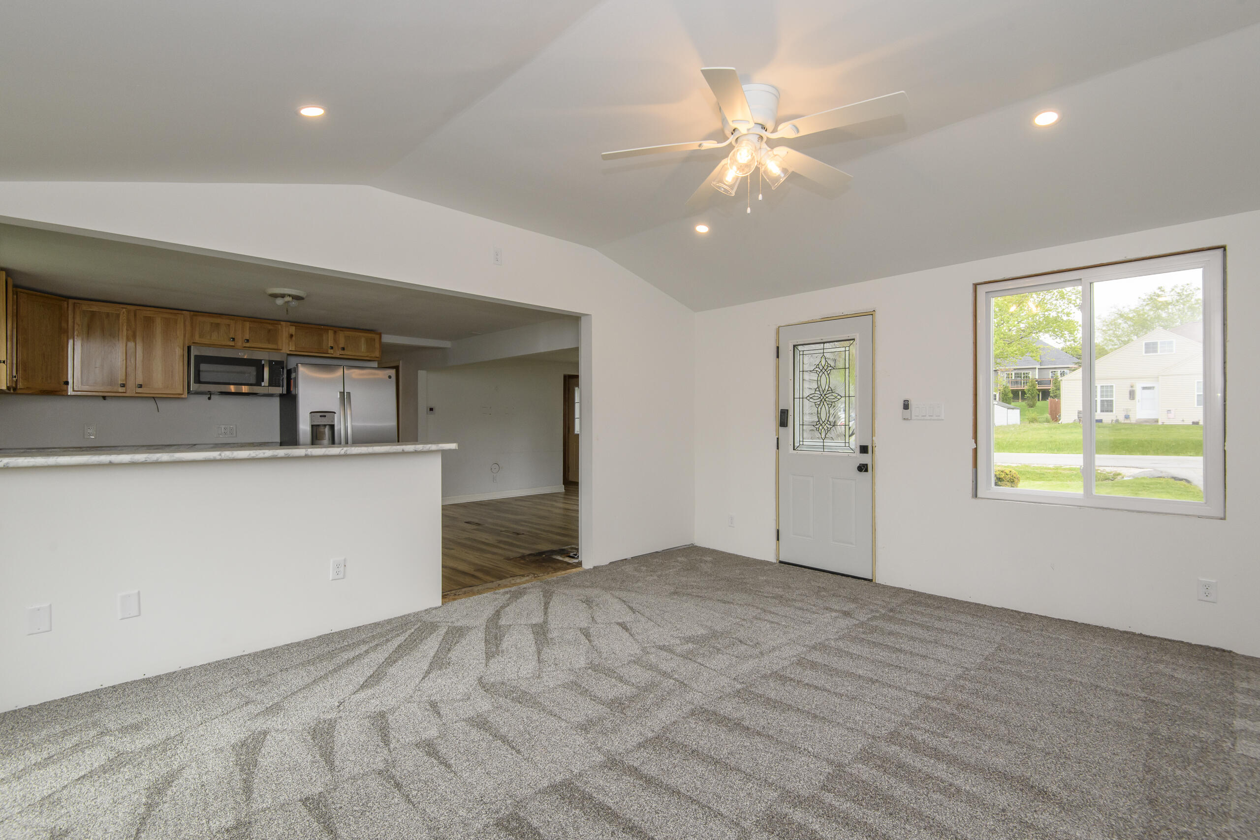 W271N2563 Pear Tree Lane Pewaukee, WI 53072 - Photo 10 of 47 Family room to kitchen