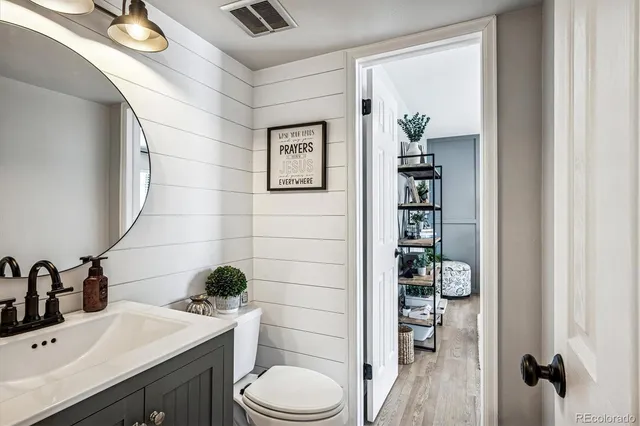 a bedroom with a bed a window and a couch