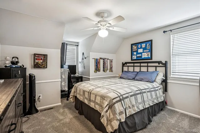 a en suite bathroom with a double vanity sink and a mirror