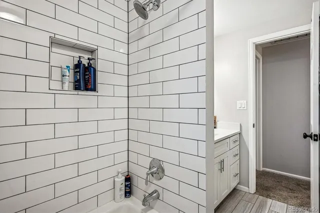 a living room with furniture gym equipment and a flat screen tv