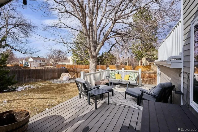 a outdoor space with patio the couches and a fireplace