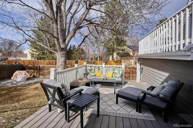 a view of a patio with table and chairs and potted plants