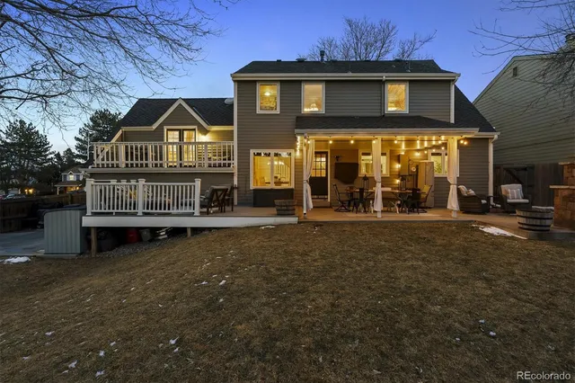 a outdoor living space with patio furniture and a fireplace