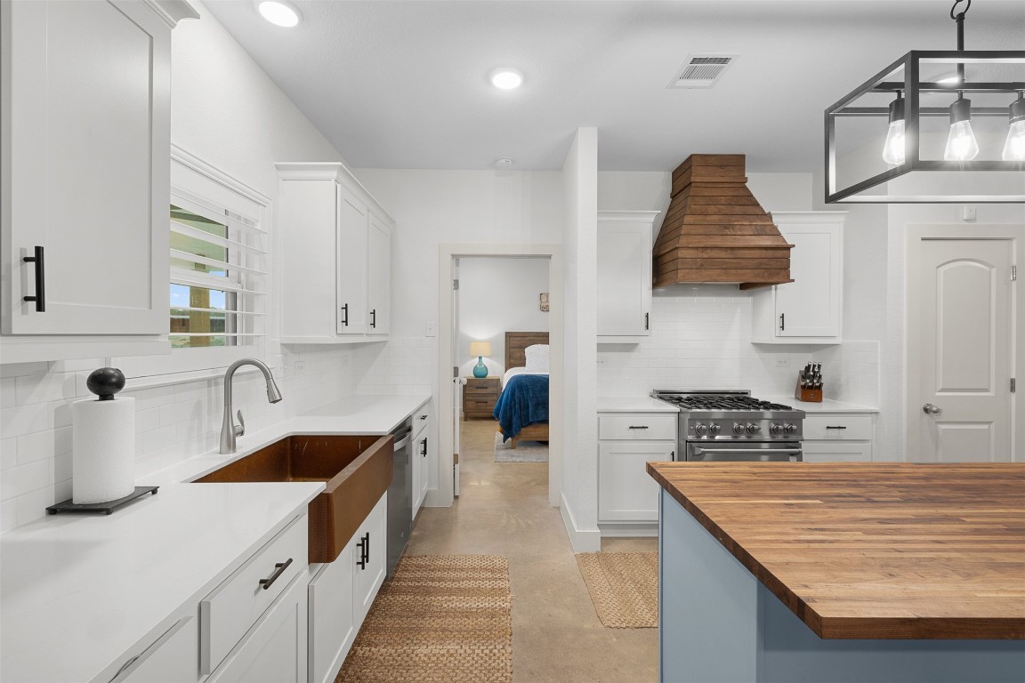 44206 Springer Road Hempstead, TX 77445 - Photo 12 of 43 a kitchen with stainless steel appliances granite countertop a sink stove and refrigerator