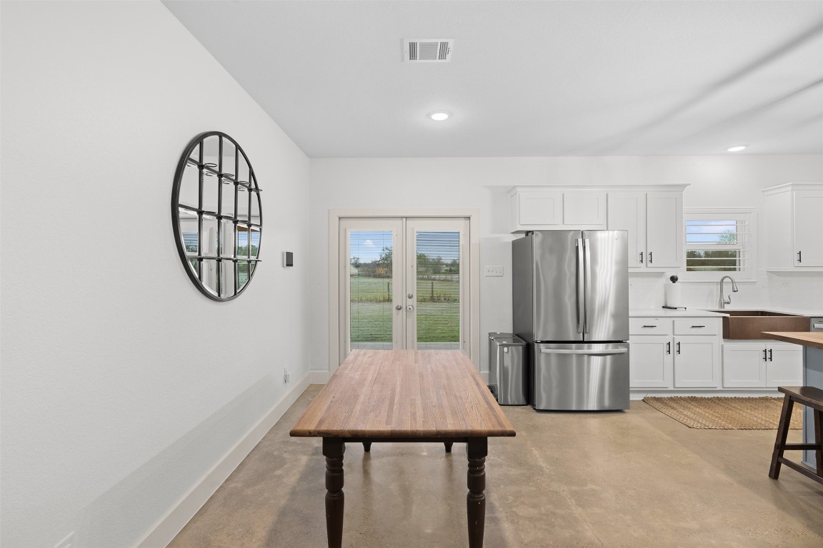 44206 Springer Road Hempstead, TX 77445 - Photo 14 of 43 a kitchen with stainless steel appliances a refrigerator a stove a microwave and dining table