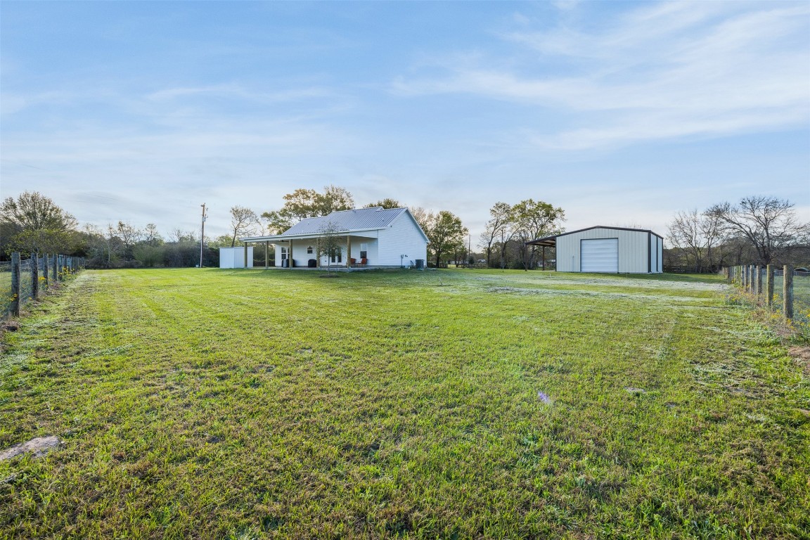 44206 Springer Road Hempstead, TX 77445 - Photo 30 of 43 a view of a house with yard and a large tree