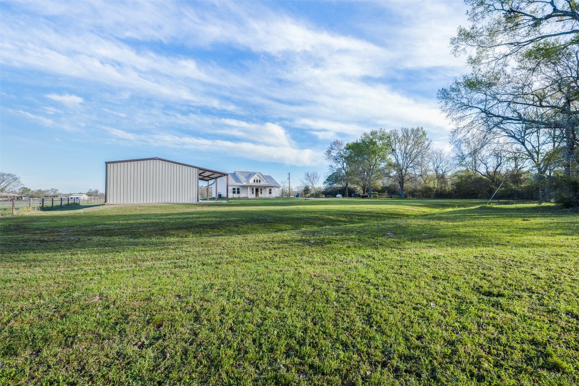44206 Springer Road Hempstead, TX 77445 - Photo 31 of 43 a view of a golf course with a lake