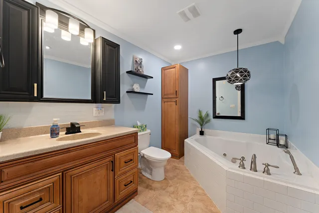 a bathroom with a bathtub sink and toilet