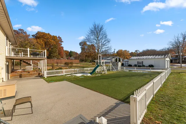 a view of a swimming pool with a garden and plants