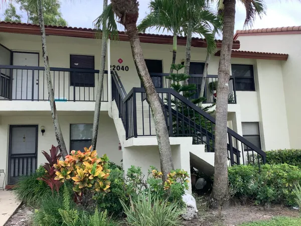a front view of a house with glass windows
