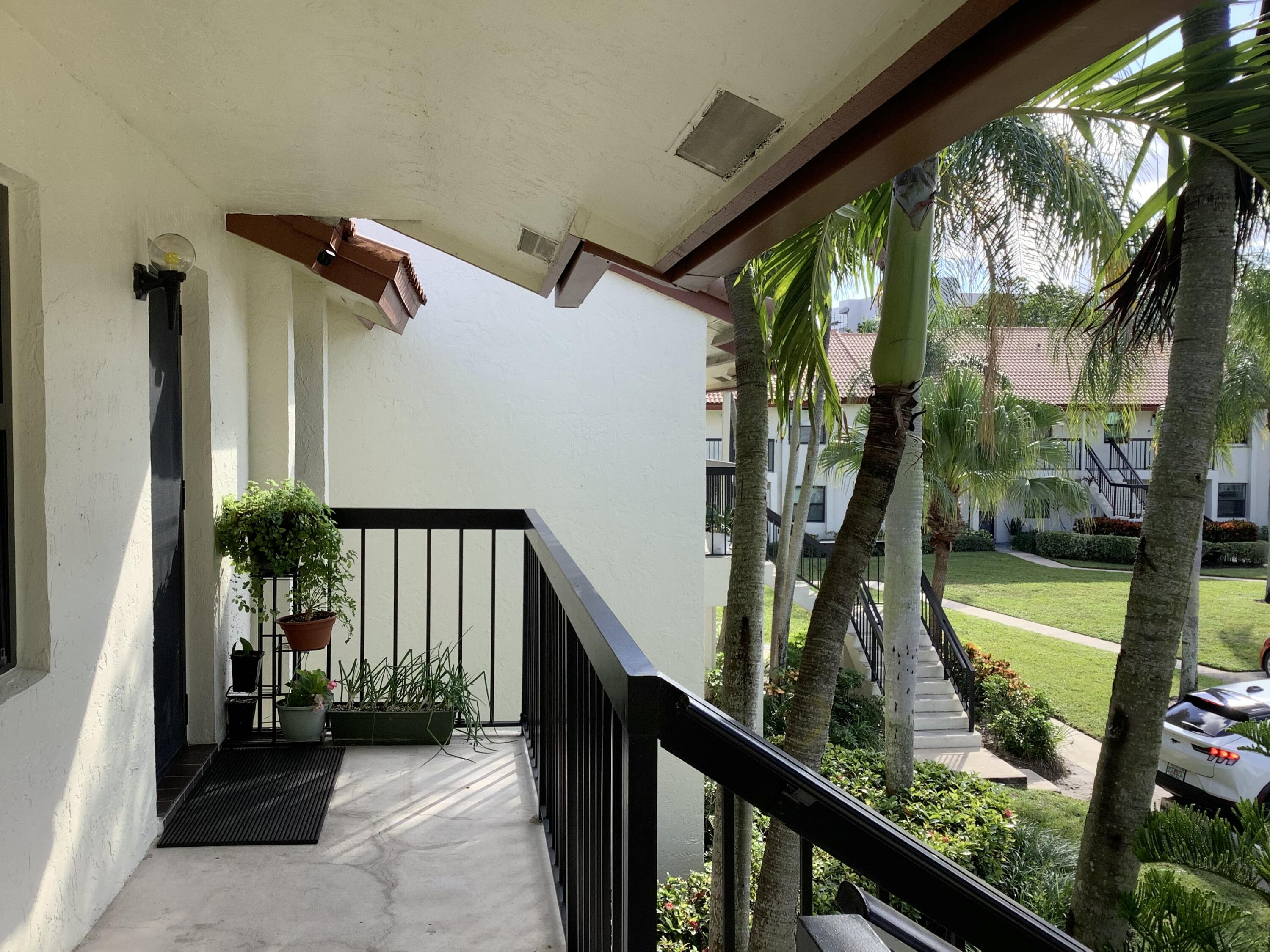 22040 Palms Way, Unit 204 Boca Raton, FL 33433 - Photo 19 of 20 a view of swimming pool from balcony
