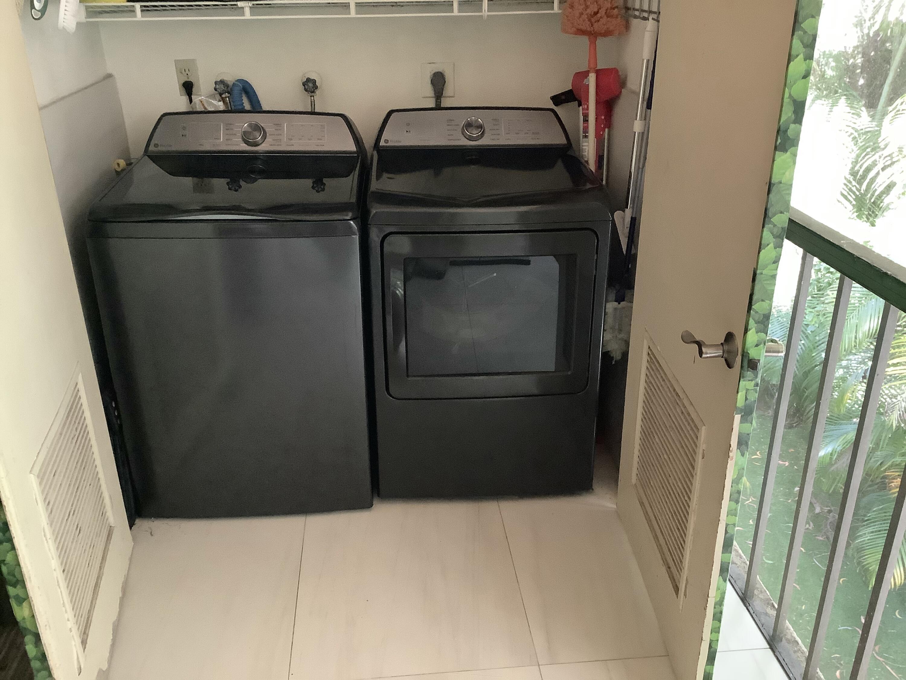 22040 Palms Way, Unit 204 Boca Raton, FL 33433 - Photo 20 of 20 a utility room with dryer and washer