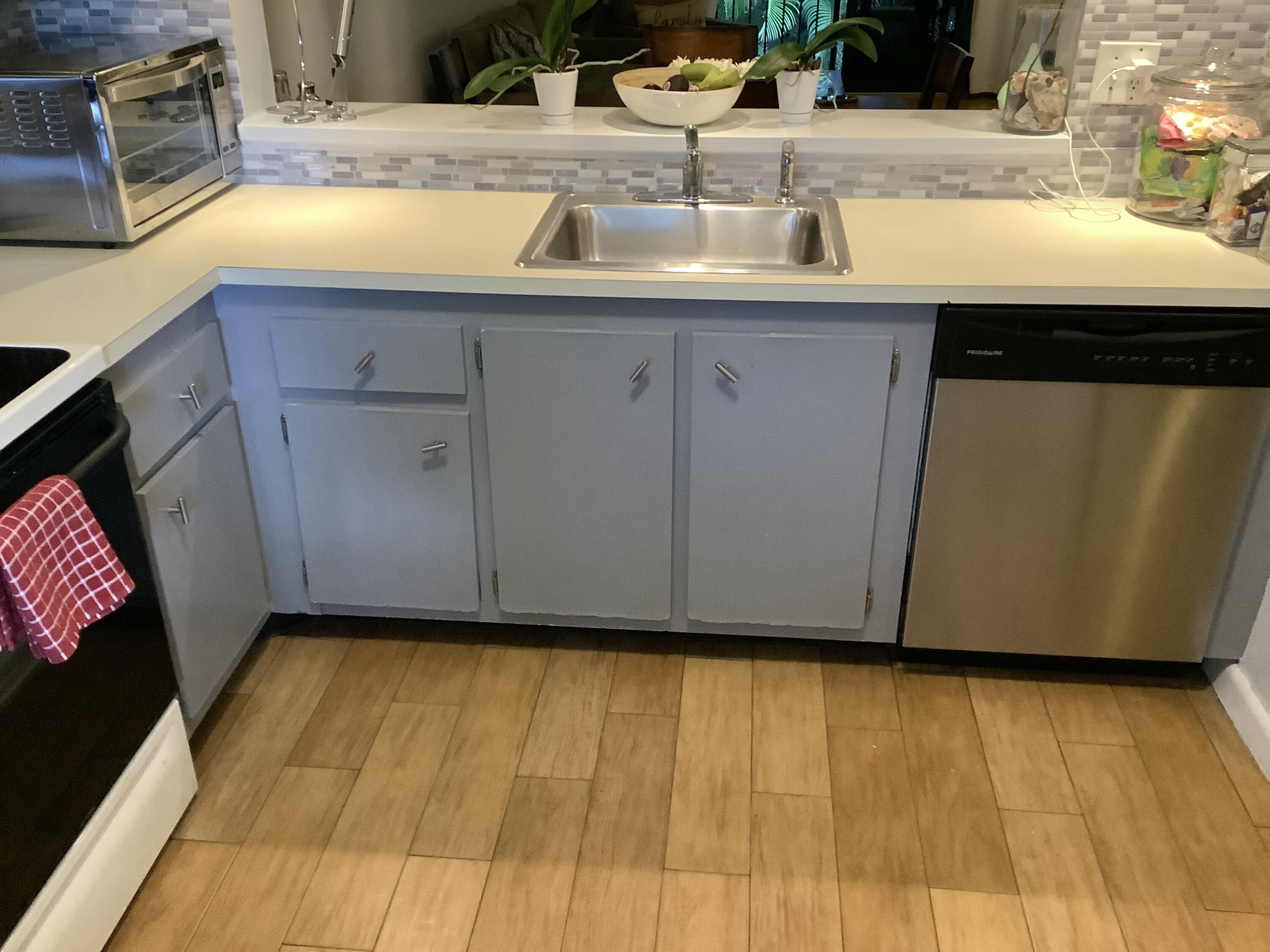 22040 Palms Way, Unit 204 Boca Raton, FL 33433 - Photo 5 of 20 a kitchen with a sink and cabinets