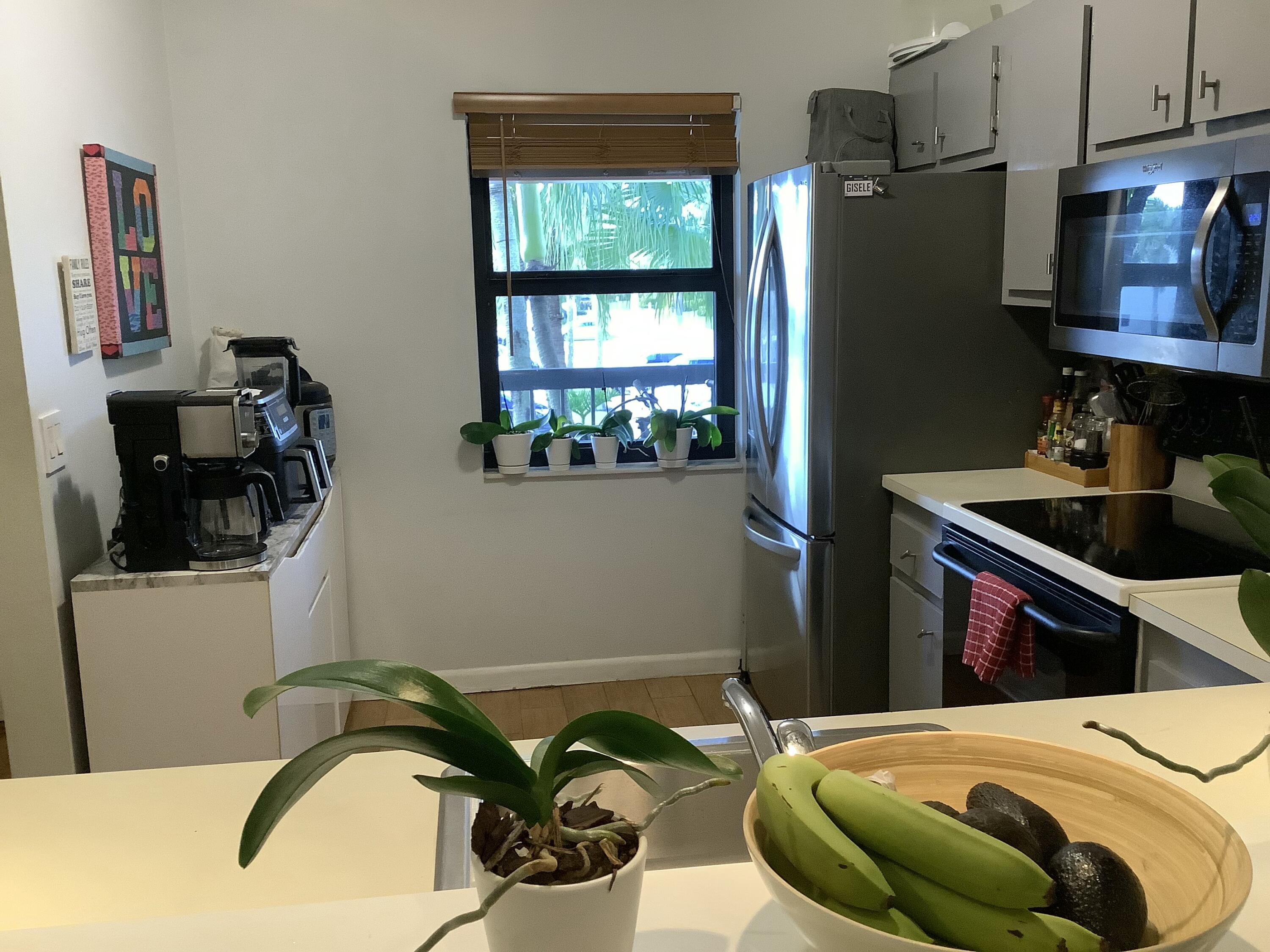 22040 Palms Way, Unit 204 Boca Raton, FL 33433 - Photo 10 of 20 a bedroom with bed and a window