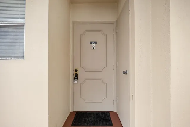 a bathroom with a granite countertop sink toilet and mirror