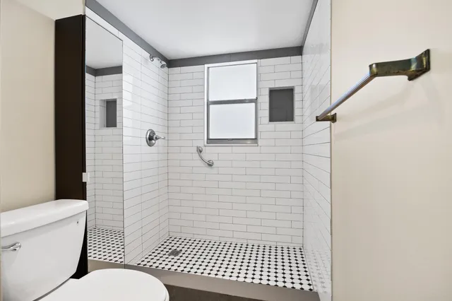 a view of a room with racks on the wall