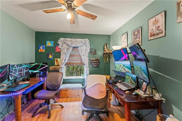 a living room with furniture a rug and a chandelier