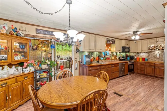 a view of a kitchen and dining area with furniture