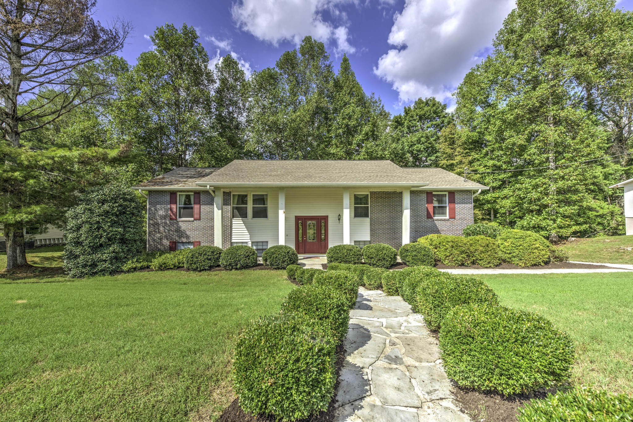 118 Garnet Lane Oak Ridge, TN 37830 - Photo 1 of 28 a front view of a house with a yard