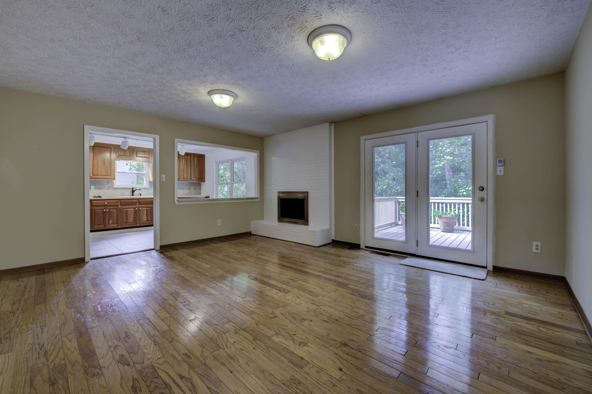118 Garnet Lane Oak Ridge, TN 37830 - Photo 11 of 28 a view of an empty room with wooden floor and a window