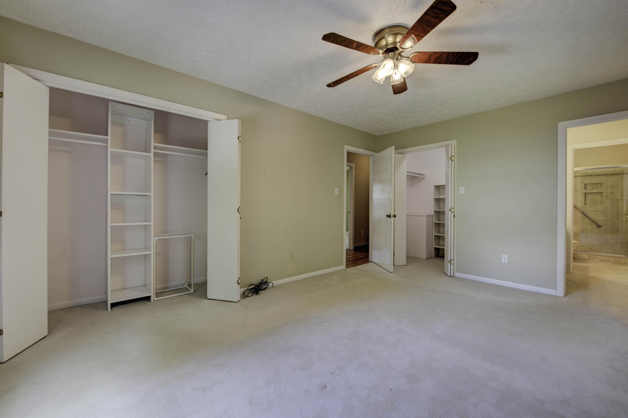 118 Garnet Lane Oak Ridge, TN 37830 - Photo 15 of 28 an empty room with closet and a ceiling fan
