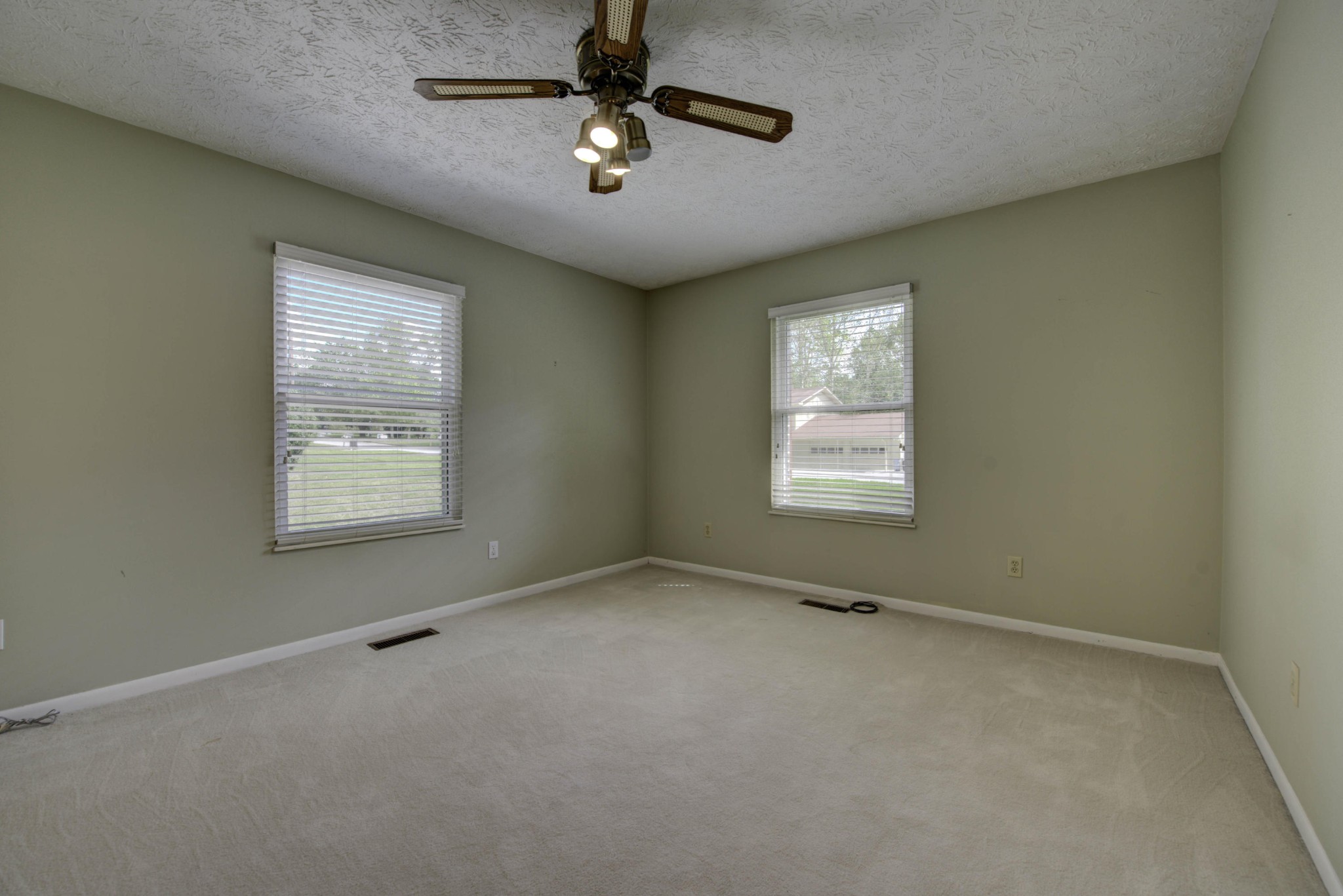 118 Garnet Lane Oak Ridge, TN 37830 - Photo 18 of 28 an empty room with windows and fan