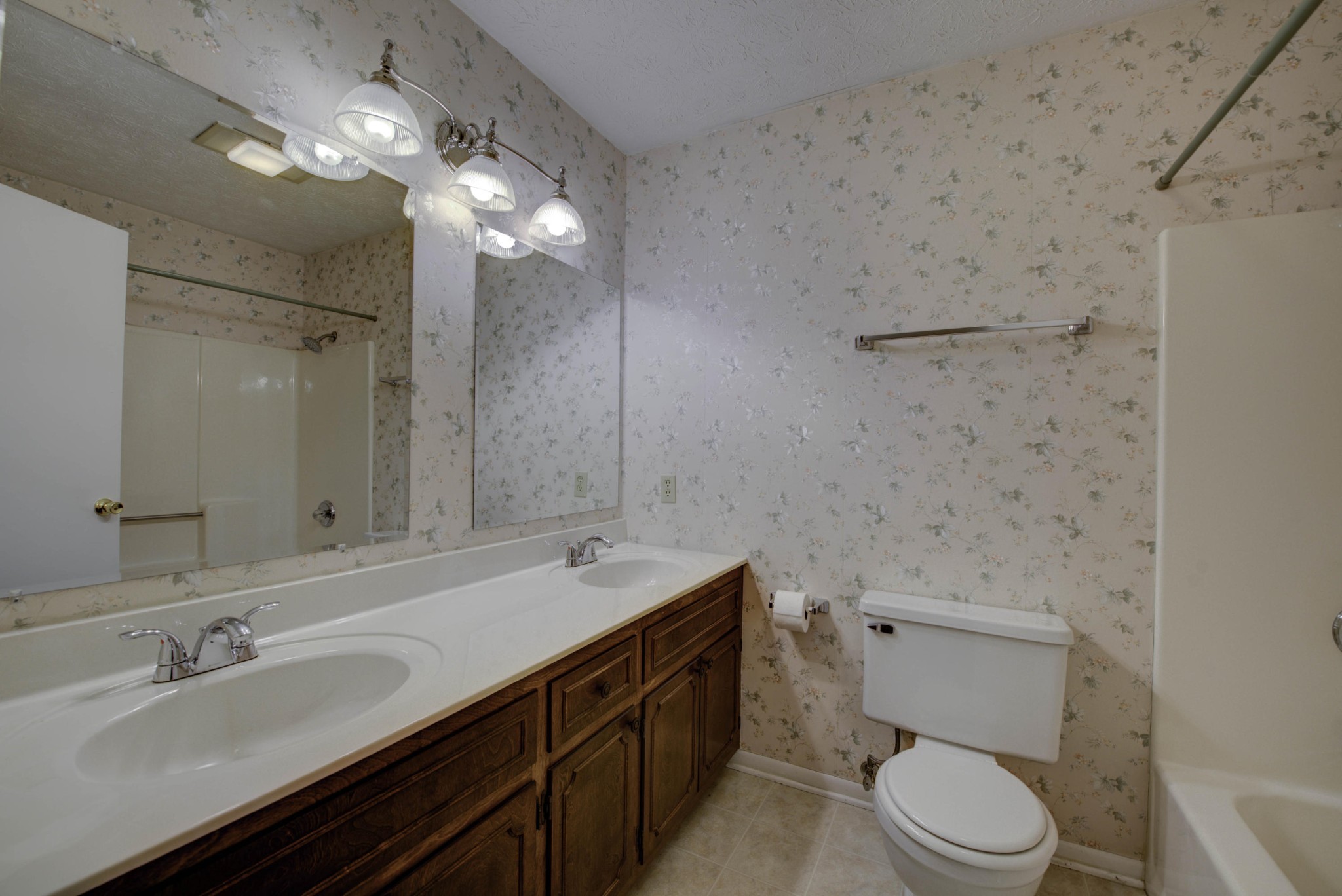 118 Garnet Lane Oak Ridge, TN 37830 - Photo 20 of 28 a bathroom with a double vanity sink toilet and a mirror