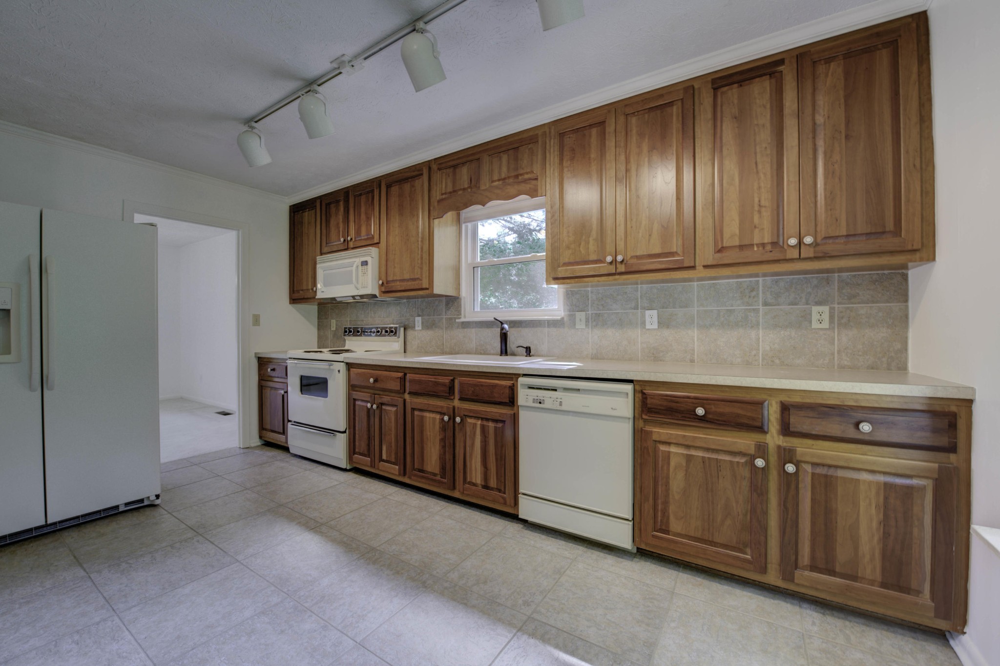 118 Garnet Lane Oak Ridge, TN 37830 - Photo 6 of 28 a kitchen with granite countertop wooden cabinets stainless steel appliances and a sink