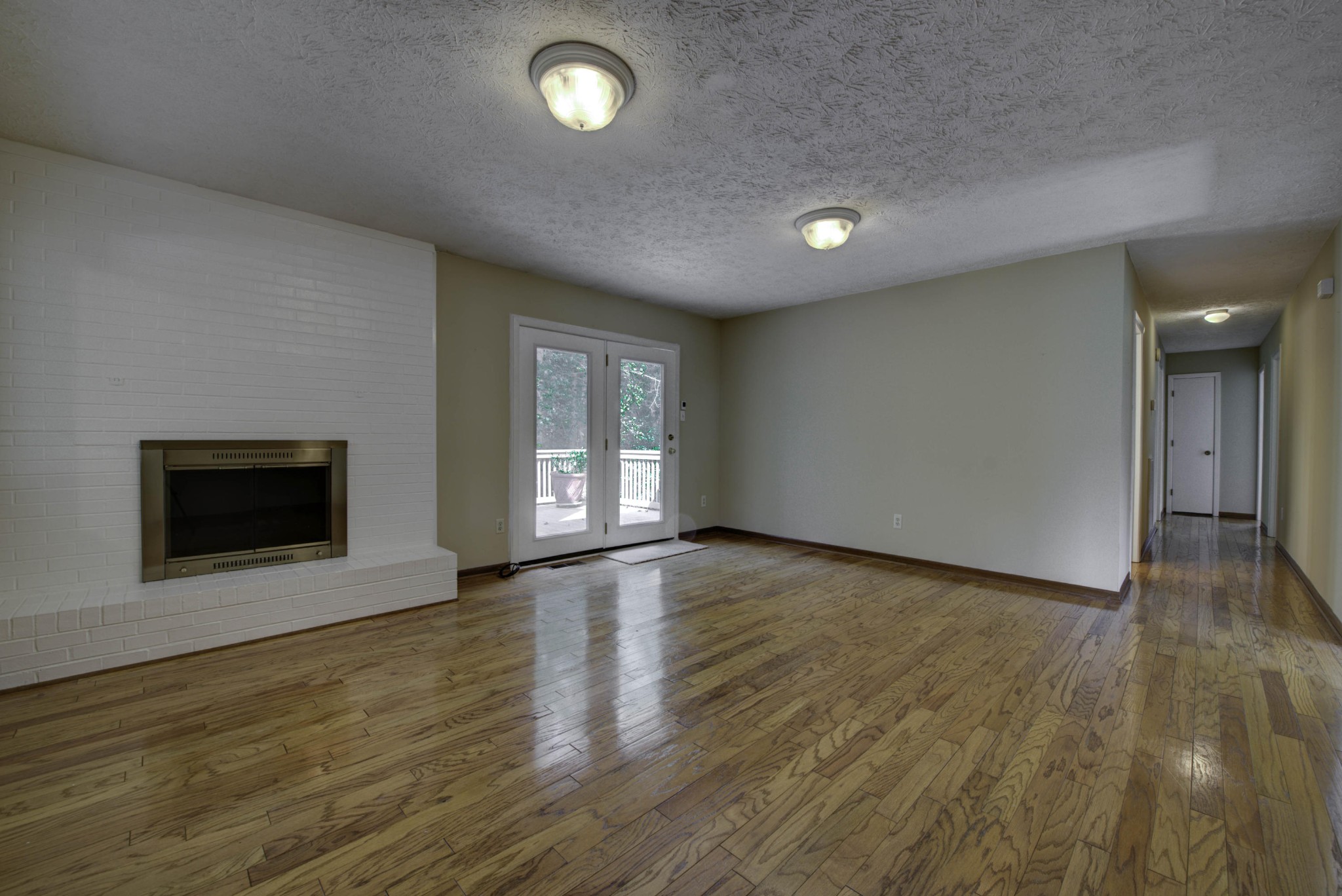 118 Garnet Lane Oak Ridge, TN 37830 - Photo 10 of 28 an empty room with wooden floor and windows