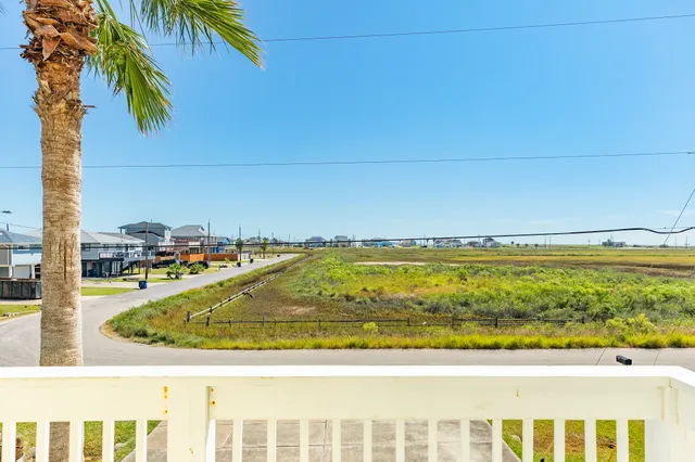 a view of a hallway with entryway wooden floor and front door