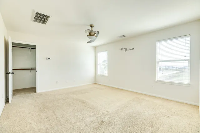 a bathroom with a shower sink and mirror