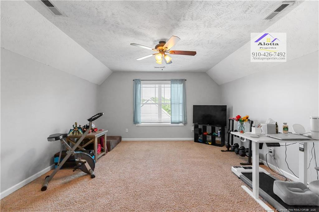 4112 Newgate Street Fayetteville, NC 28306 - Photo 20 of 32 a living room with furniture and a flat screen tv