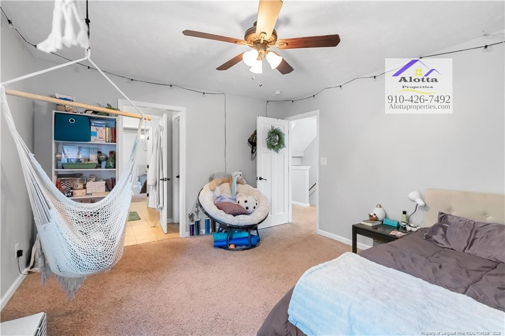 4112 Newgate Street Fayetteville, NC 28306 - Photo 26 of 32 a bedroom with furniture and a flat screen tv