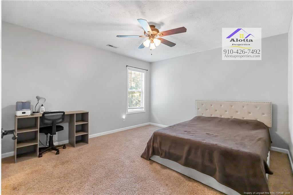 4112 Newgate Street Fayetteville, NC 28306 - Photo 28 of 32 a bedroom with a bed and a window