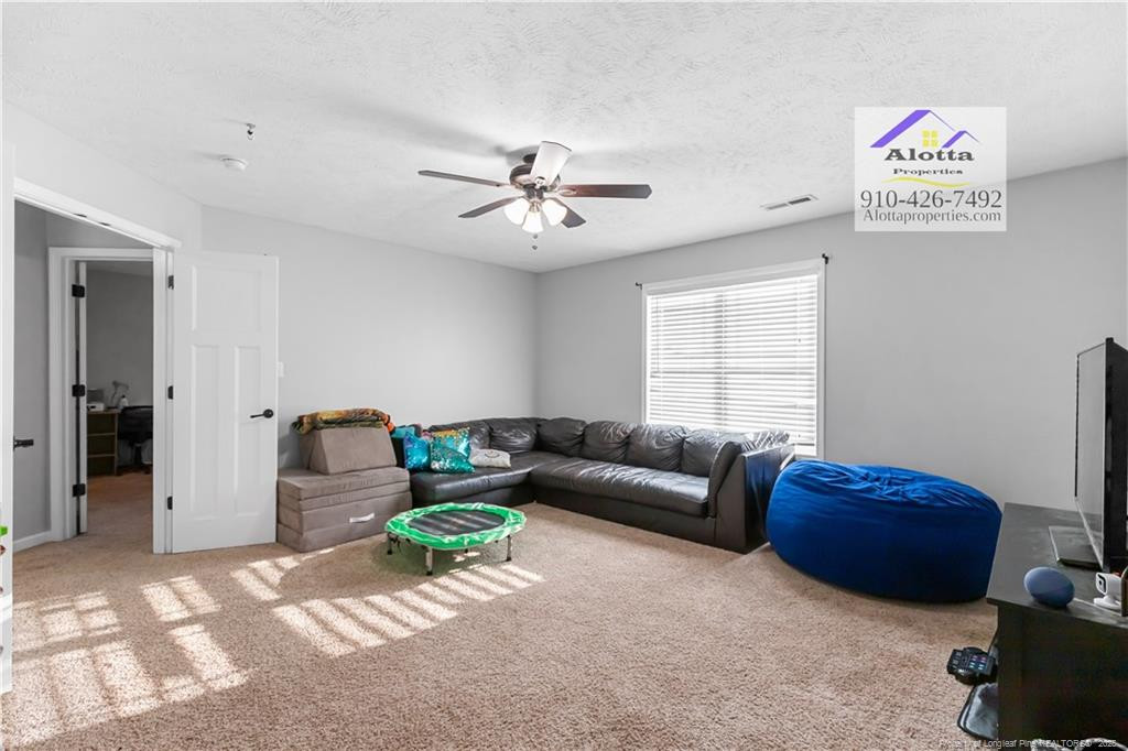 4112 Newgate Street Fayetteville, NC 28306 - Photo 30 of 32 a living room with furniture
