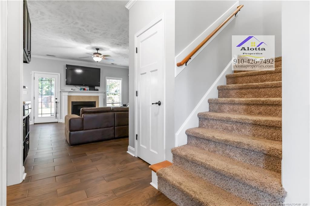 4112 Newgate Street Fayetteville, NC 28306 - Photo 3 of 32 a living room with furniture fireplace and flat screen tv