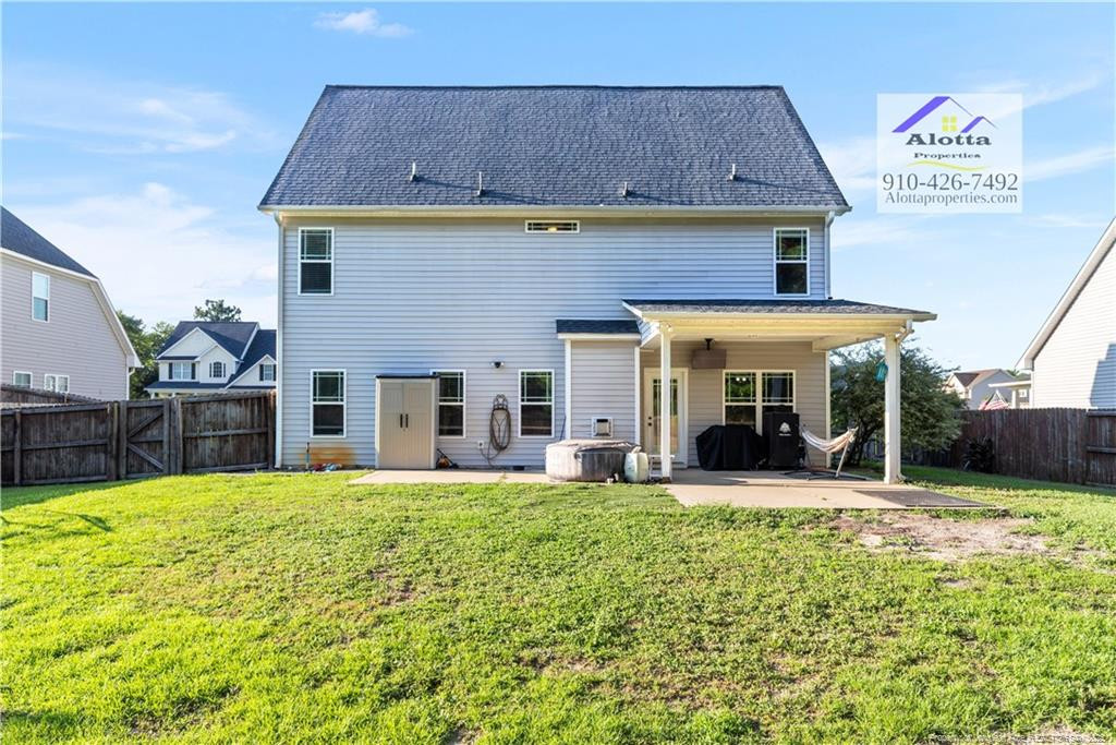 4112 Newgate Street Fayetteville, NC 28306 - Photo 31 of 32 a view of a house with a yard and sitting area