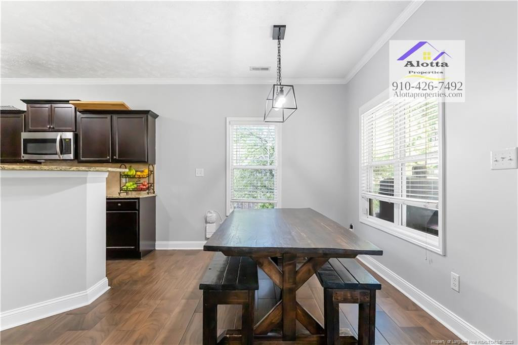 4112 Newgate Street Fayetteville, NC 28306 - Photo 9 of 32 a view of a dining room with furniture window and wooden floor