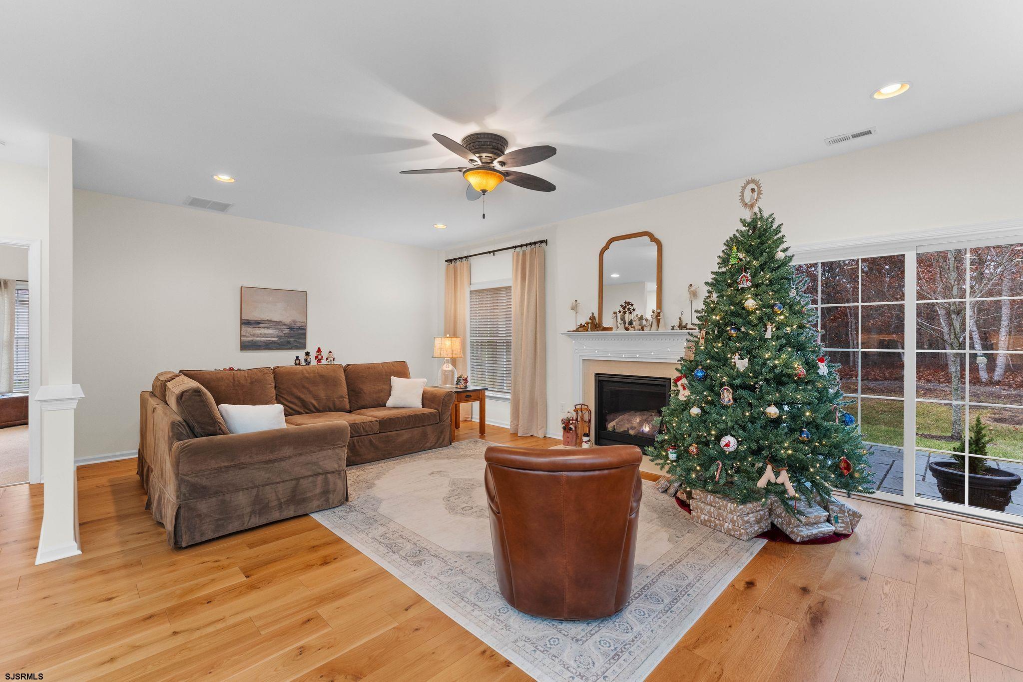 11 Daffodil Road Egg Harbor Township, NJ 08234 - Photo 14 of 50 a living room with furniture a fireplace and potted plants