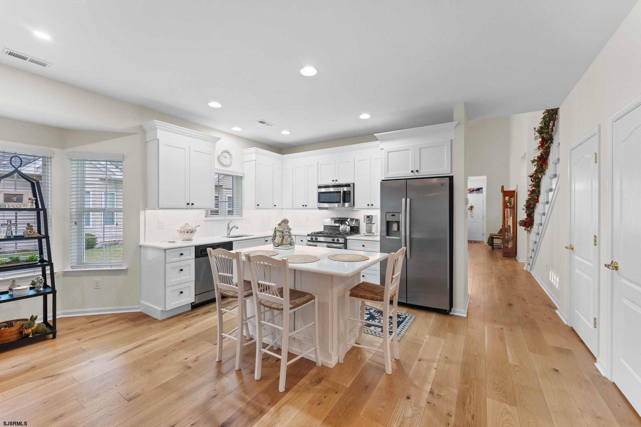 11 Daffodil Road Egg Harbor Township, NJ 08234 - Photo 15 of 50 a kitchen with appliances a sink a counter top space and cabinets