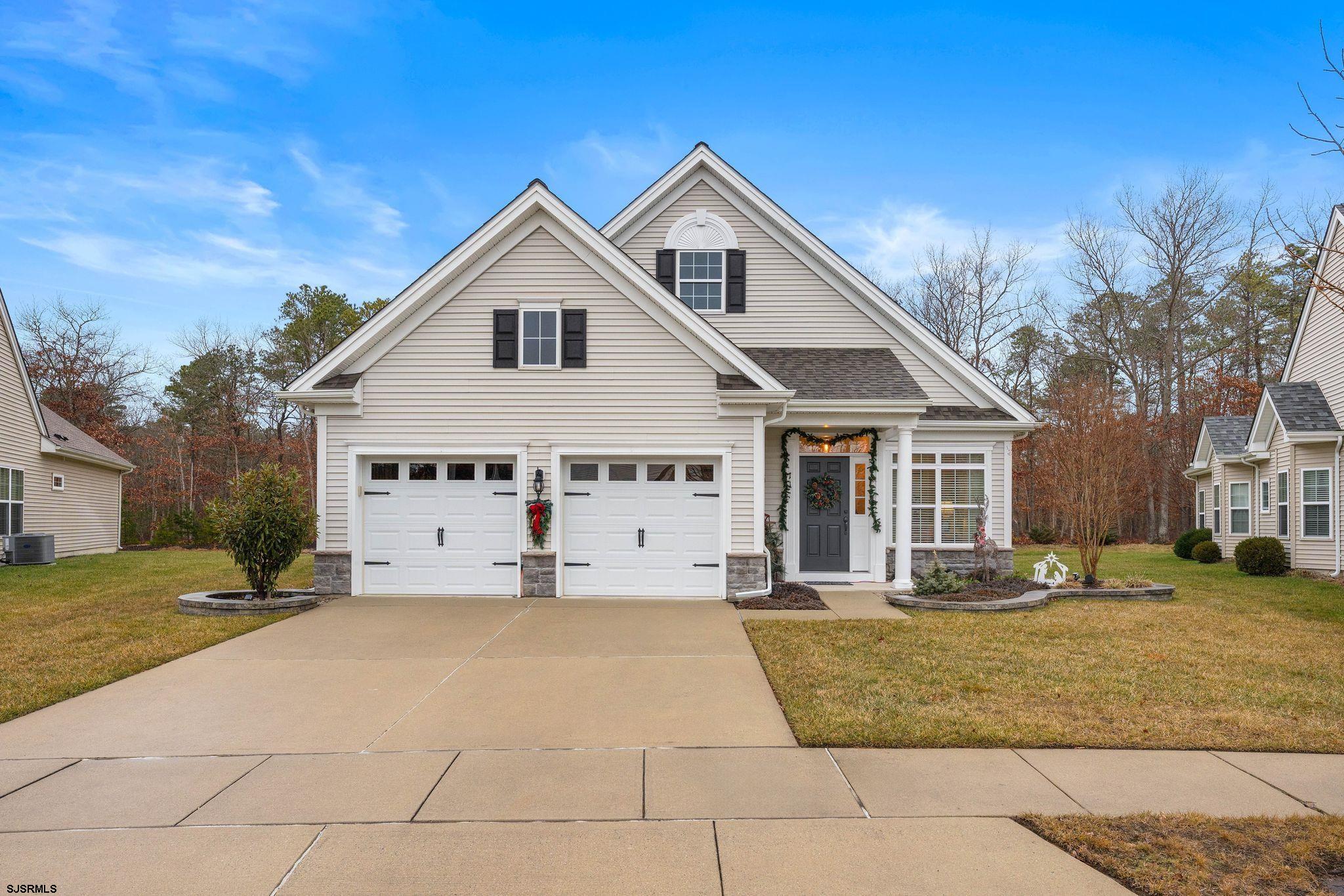 11 Daffodil Road Egg Harbor Township, NJ 08234 - Photo 2 of 50 a view of a white house with a yard