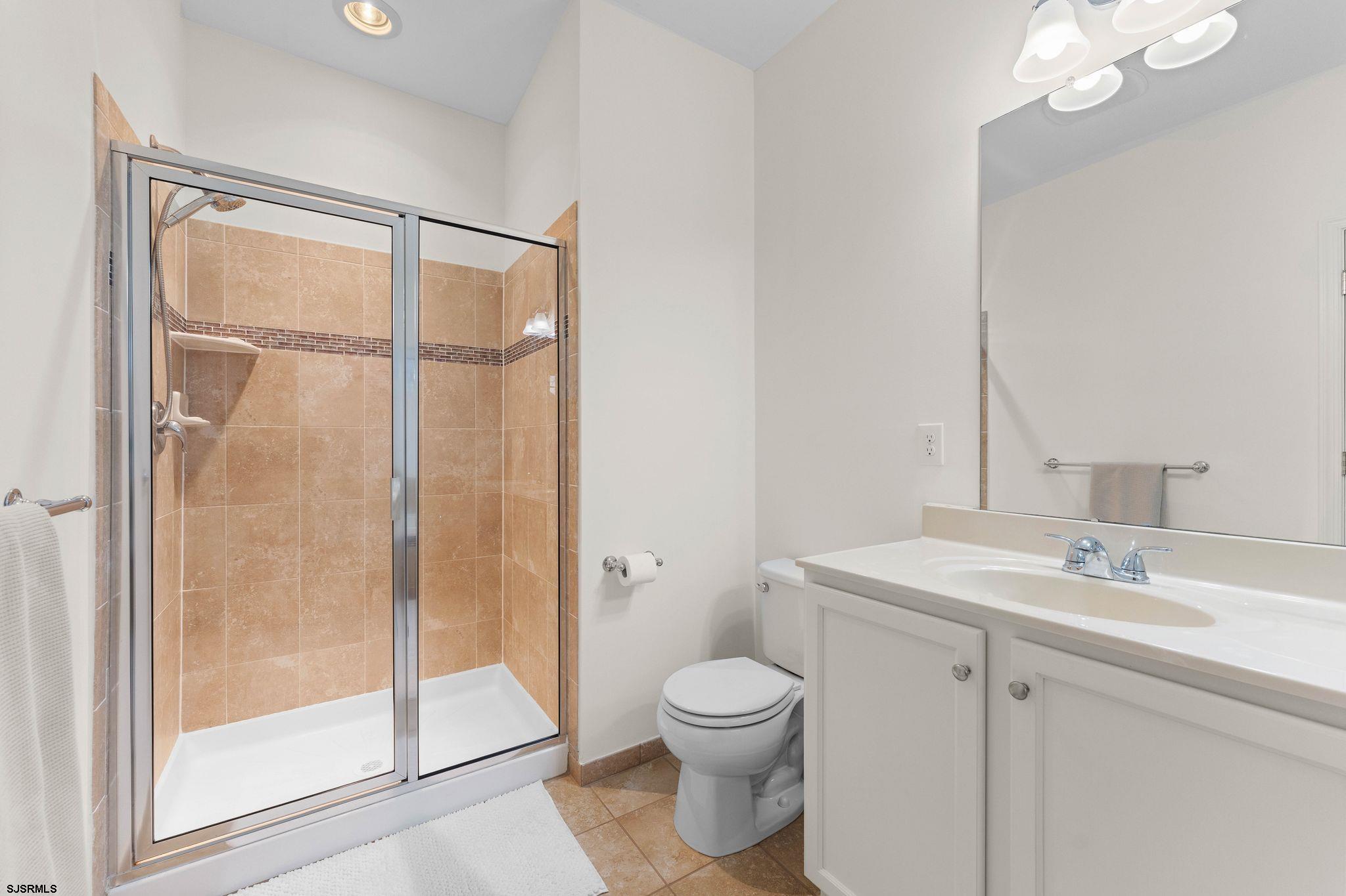 11 Daffodil Road Egg Harbor Township, NJ 08234 - Photo 21 of 50 a bathroom with a toilet shower vanity and a sink